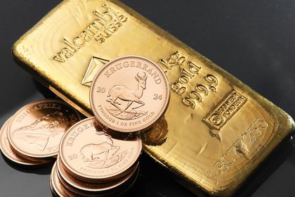 Krügerrand Goldmünze und Valcambi Goldbarren